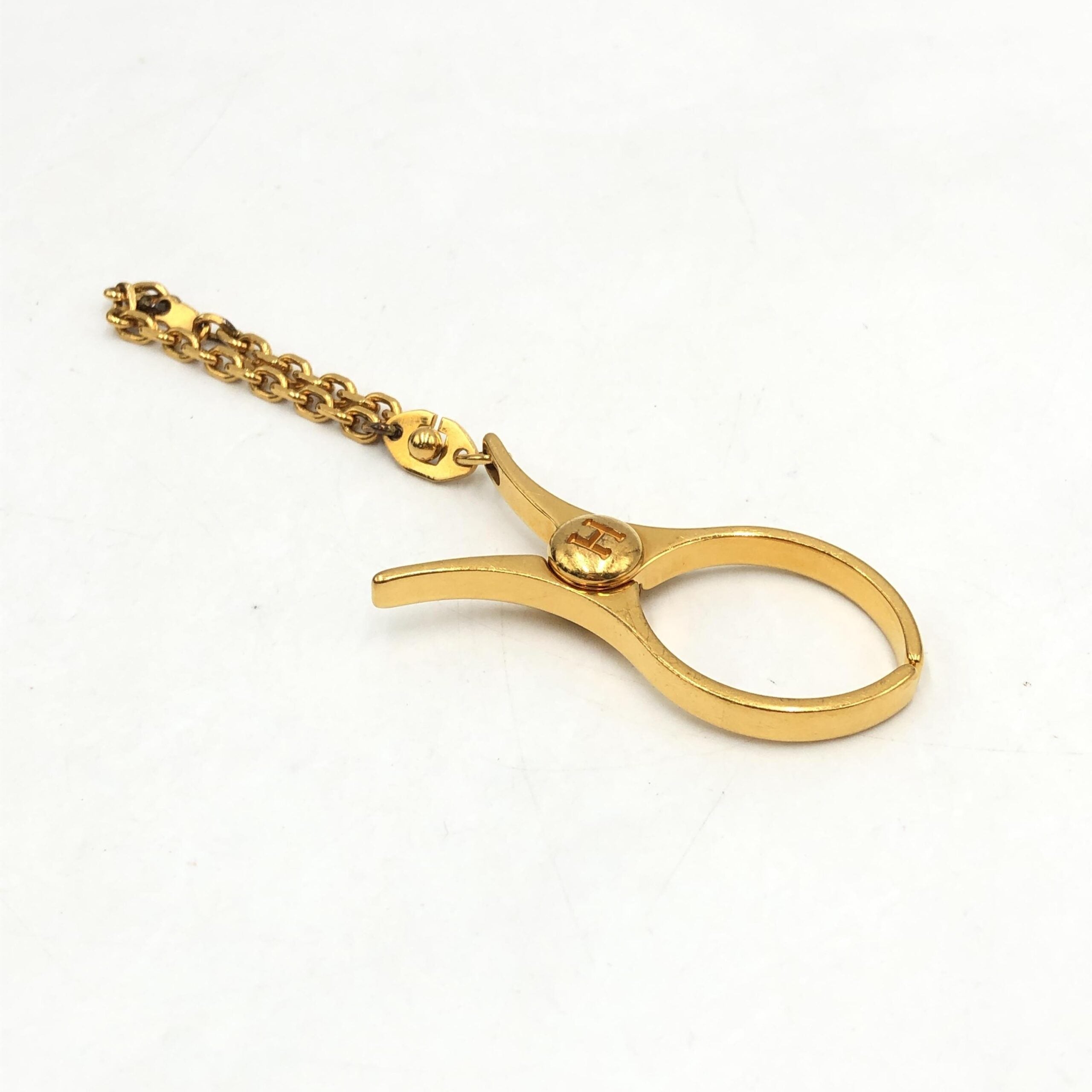 Hermès Gold Metal Glove Holder Keychain