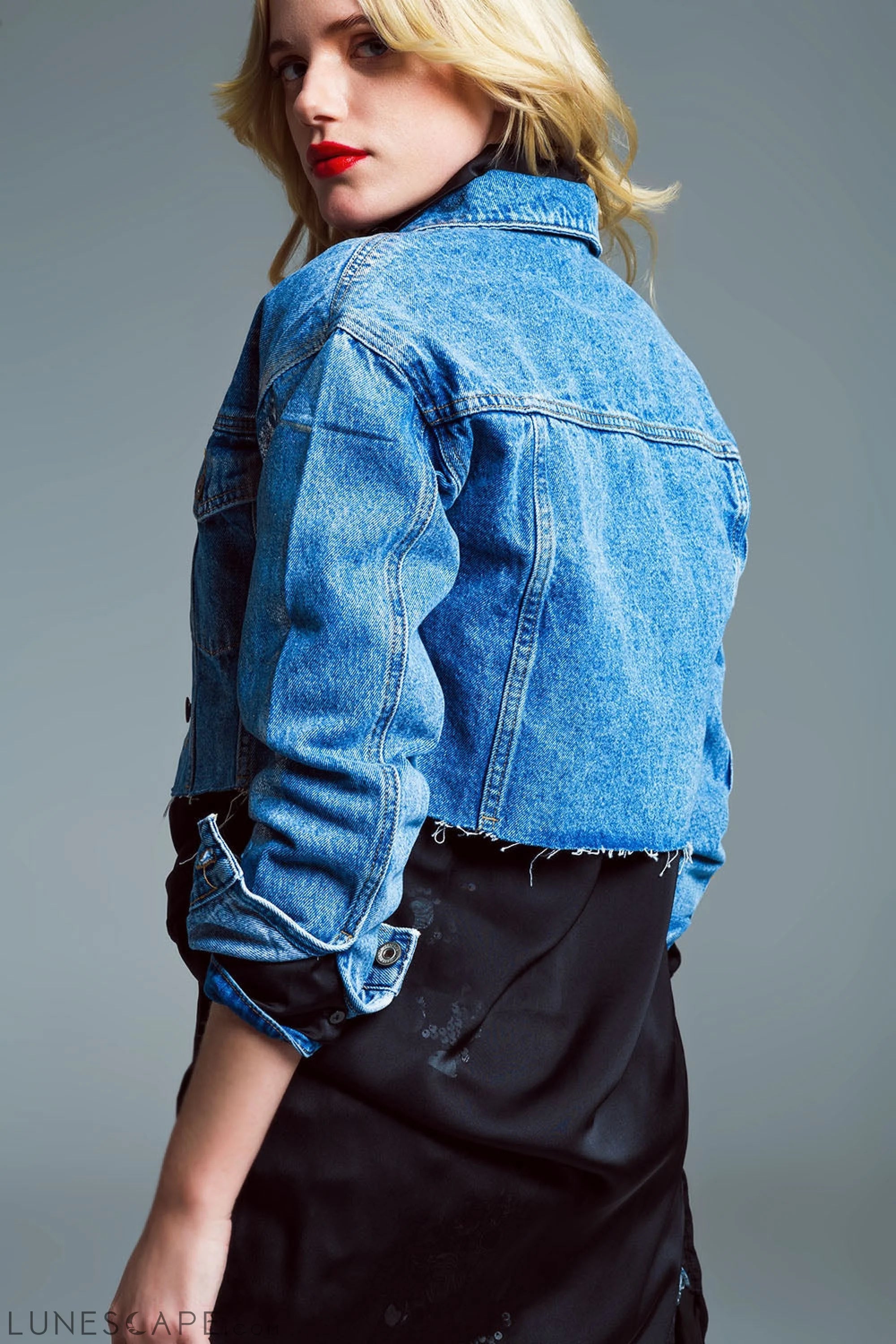 Cropped Denim Jacket  With Raw Hem in Mid Wash With Metallic Silver Finish LUNESCAPE